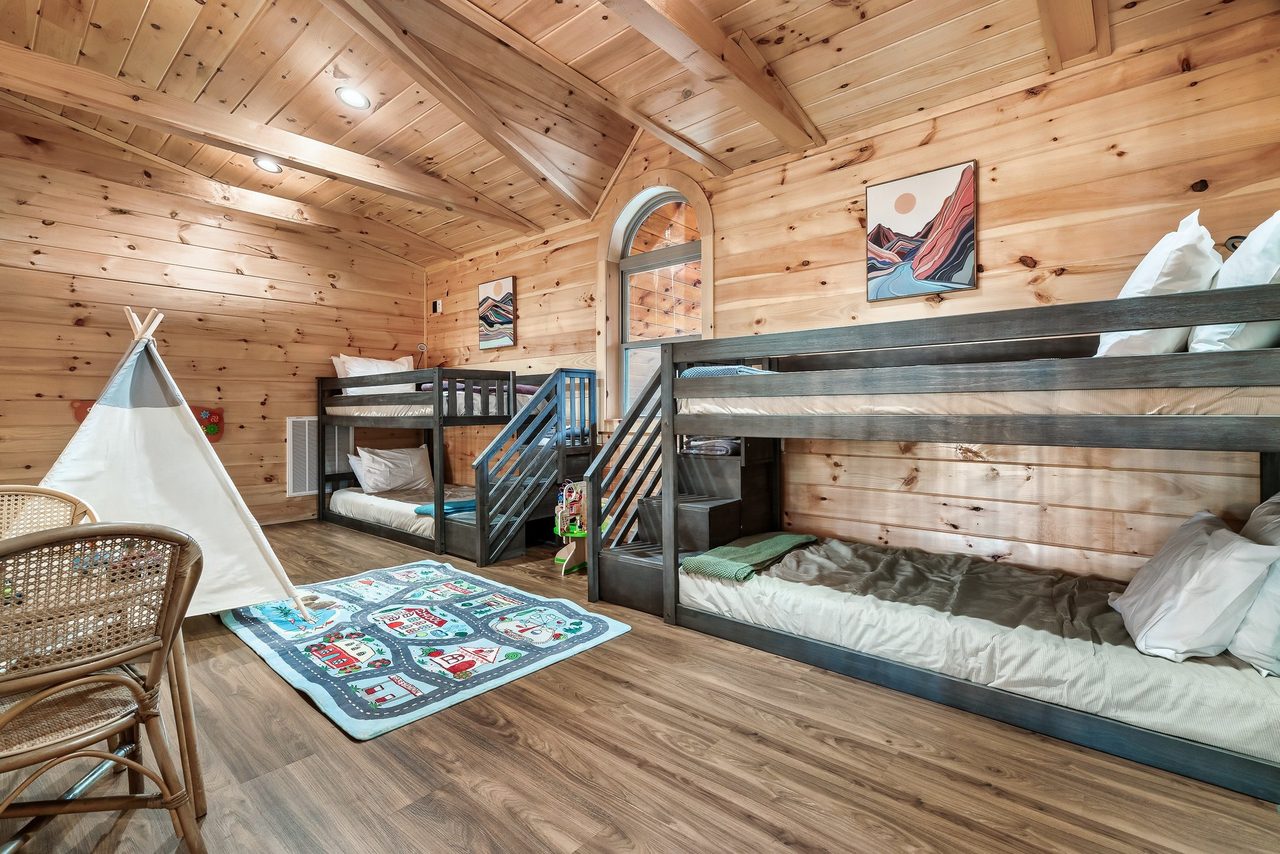 Upper level loft with 2 twin bunks and kids table