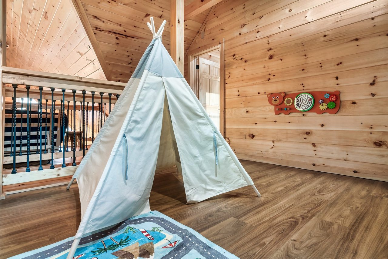 Upper level loft with 2 twin bunks and kids table